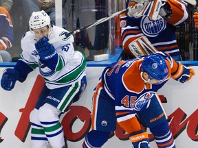 Oiler Mark Fistric put the team on an all-too-familiar path riddled with injured players Monday after a missed hit put him out of the game and on day-to-day with an injured back. (Amber Bracken, Edmonton Sun)