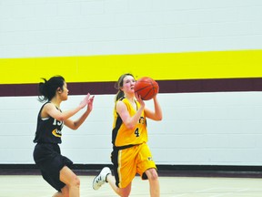 Emily Friesen of the JV Saints drives to the hoop (KEVIN HIRSCHFIELD/QMI AGENCY)