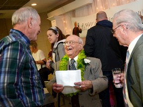 Dominic Angelo greets family and friends at an open house to celebrate his 100th birthday, Saturday afternoon at the Knights of Columbus Hall in Trenton.

Emily Mountney Trentonian