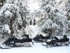 The OPP and volunteers of the EDSC stopped along one of the trails to take a moment to view the serine winter wonderland atop one of the lookouts.  
Photo supplied.