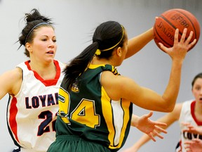 Martine Gauvin (22) of the Loyalist Lady Lancers guards an Oshawa Durham player during OCAA women's basketball action Tuesday night at Loyalist College gym. (Michael J. Brethour for The Intelligencer.)