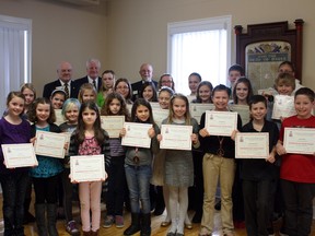 Members of the Royal Canadian Legion Branch 29 in Paris, Ontario present certificates to participants of the 2012 Poster and Literary Contest on Sunday, Jan. 13, 2013