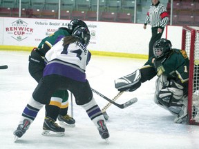 Bronco Kaitlin Sparkman waits for the rebound as the Sioux Lookout goalie makes the save. Beaver Brae won 16-0.