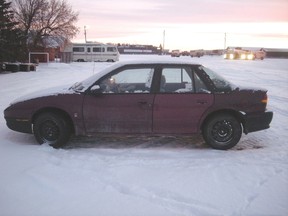 Police found this car, a 1994 Saturn SL2 believed to be owned by alleged murder victim Garland Curtis, in Olds. 
RCMP HANDHOUT PHOTO
