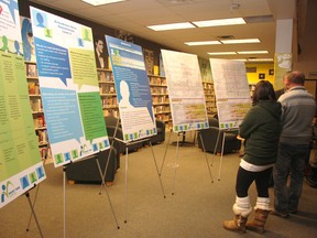 Parents check out information on proposed attendance areas for three new schools that are scheduled to open in Rocky View in September 2014 at an information session at Bert Church High School last week.
TESSA CLAYTON/AIRDRIE ECHO