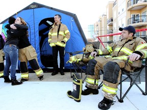 Four Edmonton Firefighters began their camp out on Monday on the roof of Fire Station #2, 10217 - 107 St., in a fundraising bid to raise $100,000 for Muscular Dystrophy. DAVID BLOOM QMI Agency