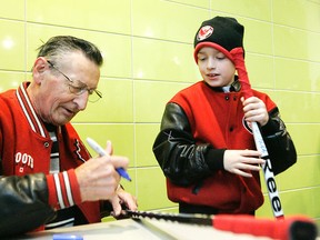 Walter Gretzky signs a stick for a fan in this April 4 photo.
QMI Agency file photo