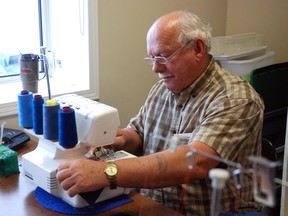 Sewing for Kids volunteer Paul Kyle works on an outfit for needy children. The group meets every Tuesday afternoon to sew and socialize. (Elizabeth McSheffrey/Daily Heald-Tribune)