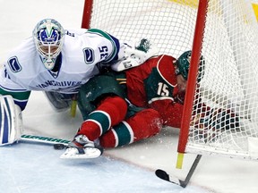 Wild's left winger Dany Heatley (right) crashes into Vancouver Canucks' goalie Cory Schneider during a Feb 9, 2012 meeting in St. Paul, Minnesota. Schneider will get the start for Vancouver Thursday. REUTERS