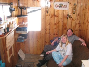 Tom Sweeney and Carol Chrismas enjoy all the comforts of home in their cozy ice fishing shack a short drive from downtown Kenora on the Lake of the Woods ice road.
