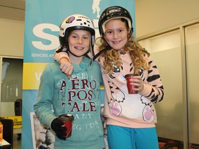 Paris Central School Grade 6 students Miranda Robinson, left, and Katie Binkley enjoy hot chocolate during a break from skating during the annual Skate for SKIP (Seniors and Kids Intergenerational Program) event, a fun day of skating for the kids who participate, at the Brant Sports Complex in Paris on Thursday, Jan. 31, 2013. MICHAEL PEELING/THE PARIS STAR/QMI AGENCY
