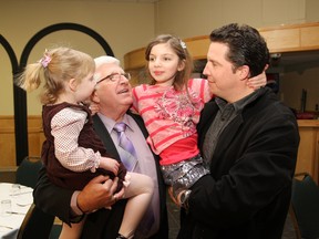 Sudbury MPP Rick Bartolucci, left, with grandchildren Maggie, 4, Mia, 6, and son-in-law, Todd Robson, at the Caruso Club in Sudbury on Thursday. Bartolucci announced that he won't run in the next provincial election. JOHN LAPPA/THE SUDBURY STAR/QMI AGENCY