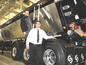 Cross Country Manufacturing of Manitoba officially opened a new operation in Blenheim on Thursday, bringing 100 new jobs to the community. Plant manager Jake Dyck, left, and president Jonathan Doerksen show off the first aggregate trailer built at the plant on Solvay Drive.
Vicki Gough/Chatham Daily News