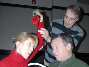 Director Michael Hennessy (standing) reviews a scene in Old Love with Catharina Warren and George Houston.