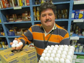 Myles Vanni, executive director of the Inn of the Good Shepherd, holds some of the eggs donated to local food banks by egg farmers in Sarnia-Lambton. The farmers recently agreed to continue their annual donation to supply fresh eggs to food banks around Sarnia-Lambton. (PAUL MORDEN, The Observer)