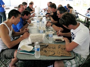 As judges for the ribs and barbecue sauce, these people had one of the best volunteer jobs at Ribfest, sampling all that the ribbers had to offer. (Ellwood Shreve, Chatham Daily News)