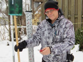 Dr. Harold Schroeter of Simcoe, a water resource engineer, is ready to take the measure of this week’s big winter storm when and if it sweeps through Norfolk County. As it stands, Environment Canada believes Norfolk will escape the worst of the weather, which begins Thursday and is expected to last through Friday. (MONTE SONNENBERG Simcoe Reformer)