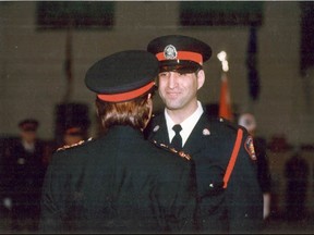 John Petropoulos receiving his badge from Chief Christine Silverberg at his police graduation. In 2000, Petropoulos died on the job after falling through a false ceiling. In his memory, his wife and a number of his police recruitment classmates created the John Petropoulos Memorial Fund. On Monday, one of its founding members will be in Grande Prairie to make workplace safety presentations. (Supplied)