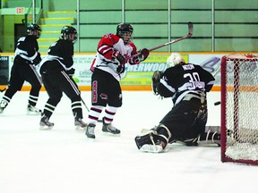 Sherwood Park Midget AAA Kings goalie Tommy Nixon gets enough of a piece of a shot to deflect it just wide of the net in his team’s crucial 4-1 over the UFA Bisons on Saturday at the Arena. Photo by Trent Wilkie/Sherwood Park News/QMI Agency