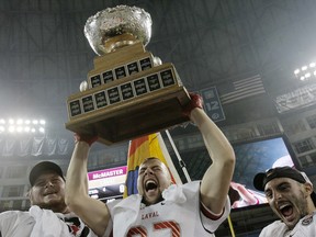 Laval Rouge-et-Or players celebrate after winning the Vanier Cup in Toronto on Nov. 23, 2012. (Stan Behal/QMI Agency)