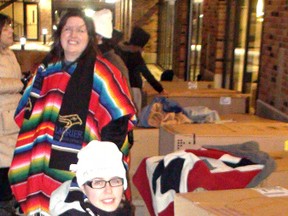 MICHAEL-ALLAN MARION, The Expositor

Rebeka Gergens (foreground) and Richelle Monaghan prepare to spend Thursday night with others in an Out In The Cold Sleep Out in the courtyard of Laurier Brantford.