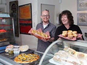 Nancy George, owner of Old Farm Fine Foods on Barrie Street, with employee Jeff Williams. (Ian MacAlpine The Whig-Standard)