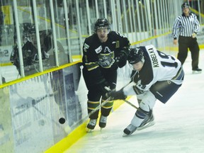 Terriers defenceman Tyler Anton looks to escape a Steinbach player's check during Thursday's 5-4 Portage win. (Kevin Hirschfield/PORTAGE DAILY GRAPHIC/QMI AGENCY)