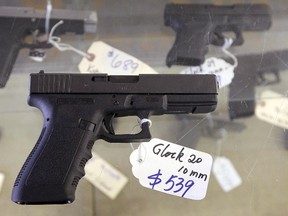 A Glock 20 10mm hand gun is displayed at the sales counter of the Guns-R-Us gun shop in Phoenix, Arizona in this file photo taken December 20, 2012. (REUTERS/Ralph D. Freso)