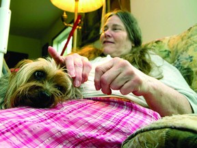 Jessica Johnson sits with her dog, Logan, at her home near Lyndhurst (Recorder and Times file photo).