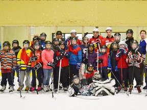 Team photo taken at Thursday morning Hawks Hockey at the Southampton Coliseum where three Owen Sound Attack players joined in all the fun.