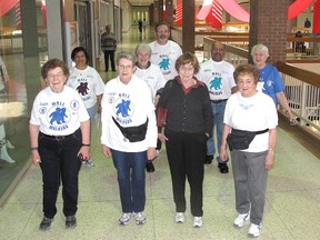 These local mall walkers were among the many who celebrated the 20th anniversary of the group at the Downtown Chatham Centre on Tuesday, Feb. 6, 2013 in Chatham, Ont. Pictured from front left are: Joy O'Brien, Edna Gerow, Joan Wilkins, Eloise Lozon. Second row, from left, are: Rosalind Braganze, Sharlene Day, Norman Braganze, Eileen Richards. In the back is Norm Lachapelle. ELLWOOD SHREVE/ THE CHATHAM DAILY NEWS/ QMI AGENCY