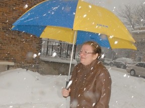 Tracy Perry of Delhi made her way through the storm in downtown Simcoe on Friday morning. The storm made driving and walking treacherous. (DANIEL R. PEARCE Simcoe Reformer)