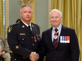 Norfolk OPP Const. Ken DeCloet, left, received a medal of bravery Friday from Governor General David Johnston in a ceremony held at Rideau Hall in Ottawa. (Sgt. Ronald Duchesne/Rideau Hall photo)