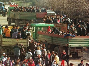 Hundreds of ethnic Albanian refugees from Kosovo arrive in trucks in the northern Albanian town of Kukes in March 1999, bringing with them tales of psychological terror and brutal killings by Serb forces, who chased them from their homes. The atrocities in Kosovo were a 'test case' for the human security agenda, says former foreign affairs minister Lloyd Axworthy. The international military action that stopped the Serbs led to a search for balance between national sovereignty and human security, resulting in the Canadian-driven 'Responsibility to Protect' doctrine.