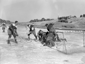 Canadian soldiers playing hockey on the Imjin River in Korea during the Korean War. A team of parliamentarians will play a team of military personnel in a game of hockey on the Rideau Canal on Sunday to remember and honour those Canadians who served in Korea during the war. This photo was provided by Senator Yonah Martin who organized the game. Brant MP Phil McColeman will be playing goal for the parliamentary team all-stars. (Photo courtesy of Senator Yonah Martin)