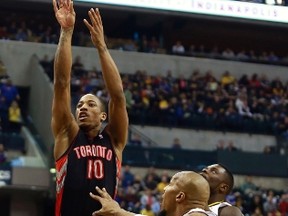Raptors guard DeMar DeRozan (10) shoots the basketball over Indiana Pacers forward David West (front R) during the first quarter of their NBA basketball game in Indianapolis, Indiana February 8, 2013. (BRENT SMITH/Reuters)