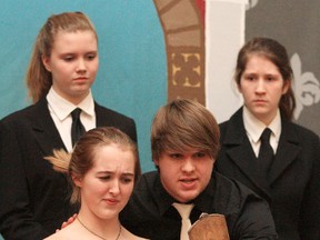 Hamlet played by Andrew Watton, front right, confronts his mother Gertrude (Emilie Trimbee) about her role in his father’s murder during a rehearsal of Hamlet. In the background are Kersti Landra, left, and Lilliah King, in their role as royal guards.