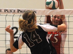 Barb Cranston	of the Wolves blocks the kill attempt from Griffin  Kimberly Bolin.The (national) No. 15 ranked Grande Prairie Regional College Wolves beat the No. 7 ranked Grant MacEwan Griffins 3-1 in ACAC women's volleyball at GPRC gym in Grande Prairie, Alberta, Friday, Feb. 8, 2013.TERRY FARRELL/DAILY HERALD-TRIBUNE/QMI AGENCY