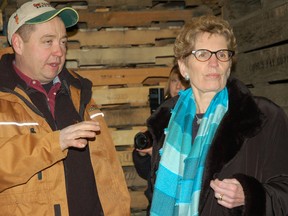Ontario premier-designate Kathleen Wynne, right, is given a tour of Gwillimdale Farms' packing facility by owner John Hambly, Feb. 6, 2013. (Miriam King/QMI Agency)