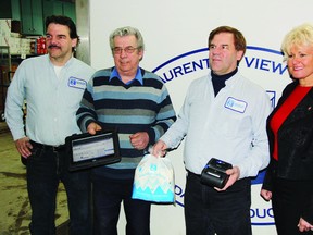 Thanks to two federal grants, Laurentian View Dairy purchased new software to change how it does business. In the photo with the Eagle Business Management system is (left to right) co-owner John Tracey, employee Ray Cochrane, co-owner/CEO Tom Tracey and Renfrew-Nipissing-Pembroke MP Cheryl Gallant.