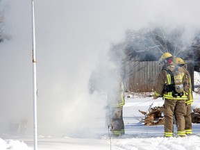 A fire call originally believed to be at the Flamingo Hotel on Grand Ave. E. around 11:15 a.m. Saturday, Feb. 9, 2013, in Chatham, Ont., turned out to be an open burn at a home on Vanier Dr. Firefighters quickly put out the blaze with a hand-held fire extinguisher and a shovel. ELLWOOD SHREVE/ THE CHATHAM DAILY NEWS/ QMI AGENCY