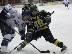 The Melfort Mustangs' Jarrett Zentner works for position against Logan Sproule of the Humbolkdt Broncos during the Mustangs' 4-2 loss on Friday, Feburary 8 at the Northern Lights Palace.