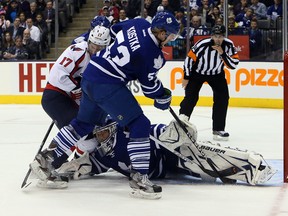 Mike Kostka, helping out James Reimer during the Leafs' lone home win this season, has gone through the Gardens/ACC crowd experience both as a fan and as a player. (Dave Abel, Toronto Sun)