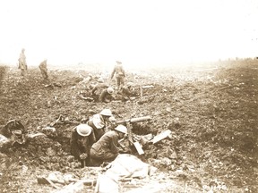 A Canadian machine-gun crew digs in on Vimy Ridge during the First World War. (QMI Agency file photo)