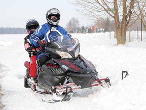 Mark Vantvoort and his daughter Ashleigh, 10, of Gadshill were among area snowmobilers enjoying the countryside Sunday following Friday's snowstorm.