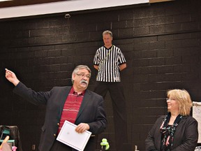 HEATHER CARDLE, For The Expositor

Referee Marty Chapple watches Brant MPP Dave Levac make a presentation to Christine Pizzey of Child Hunger Brantford during a Family Fun Fair on Saturday at Major Ballachey School.