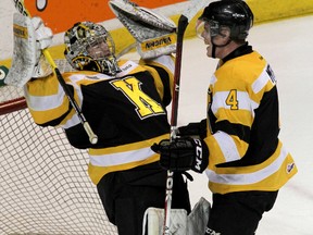 Kingston Frontenacs goalie Mike Morrison and defenceman Mike Moffat celebrate the team's first win since January 6,  a 3-1 win Sunday afternoon victory over the Windsor Spitfires at the K-Rock Centre  to end a 12-game losing streak. (Ian MacAlpine The Whig-Standard)