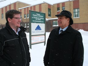 Nick Stewart, policy and communications director with the Timmins Chamber of Commerce, chats with Phil Barton, president of the Timmins chamber, in this Daily Press file photo.
