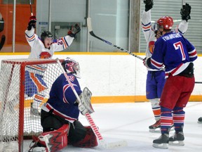 Monkton Wildcats’ Brett Priestap (behind the net) celebrates linemate Dan Raycraft’s eventual winning goal in the third period against a stunned Clinton Radars’ squad last Saturday in Game 4 of their best-of-seven WOAA Senior ‘AA’ quarter-final series in Monkton. The goal put Monkton up 2-0 in the game, and it ended in a 2-1 decision to give the ‘Cats the sweep of the series.