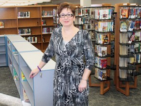 Pat McGurk, Elliot Lake’s chief librarian, at the counter of the library on opening day in its temporary home. Photo by JORDAN ALLARD/THE STANDARD/QMI AGENCY